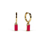 Pink hoop earrings with a sleek, modern design that add a soft pop of color to everyday style.
