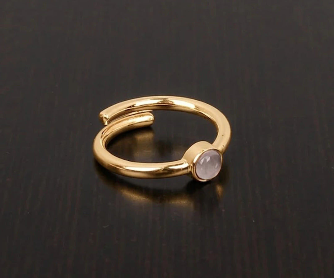 Minimalist rose quartz gemstone ring featuring a natural blush pink stone in a timeless design