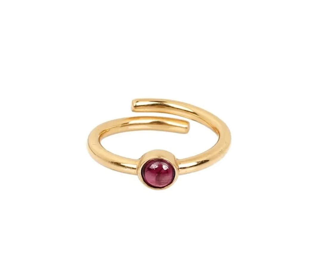 Elegant rhodolite garnet ring with deep pink gemstone set in a polished band perfect for everyday wear or special occasions