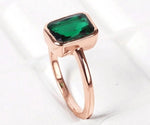 Sparkling lab emerald engagement ring with a timeless and elegant design
