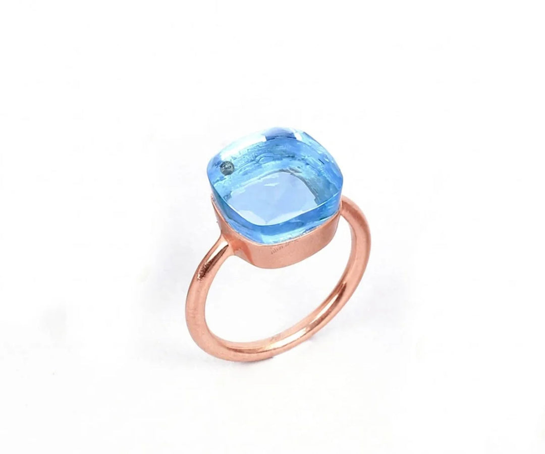 Dainty blue topaz ring in sterling silver with a minimalist and elegant design