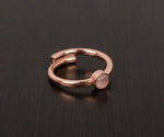 Classic rose quartz statement ring with smooth oval stone in a feminine and romantic style
