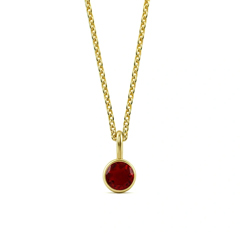 This ruby birthstone necklace features a bold red gemstone set in a classic pendant necklace for women.

