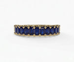 Vintage-inspired sapphire engagement ring featuring baguette cut blue sapphire in a refined and timeless setting
