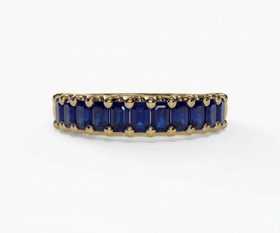 Vintage-inspired sapphire engagement ring featuring baguette cut blue sapphire in a refined and timeless setting