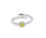 Stylish peridot birthstone ring in silver with a bright lime green gemstone
