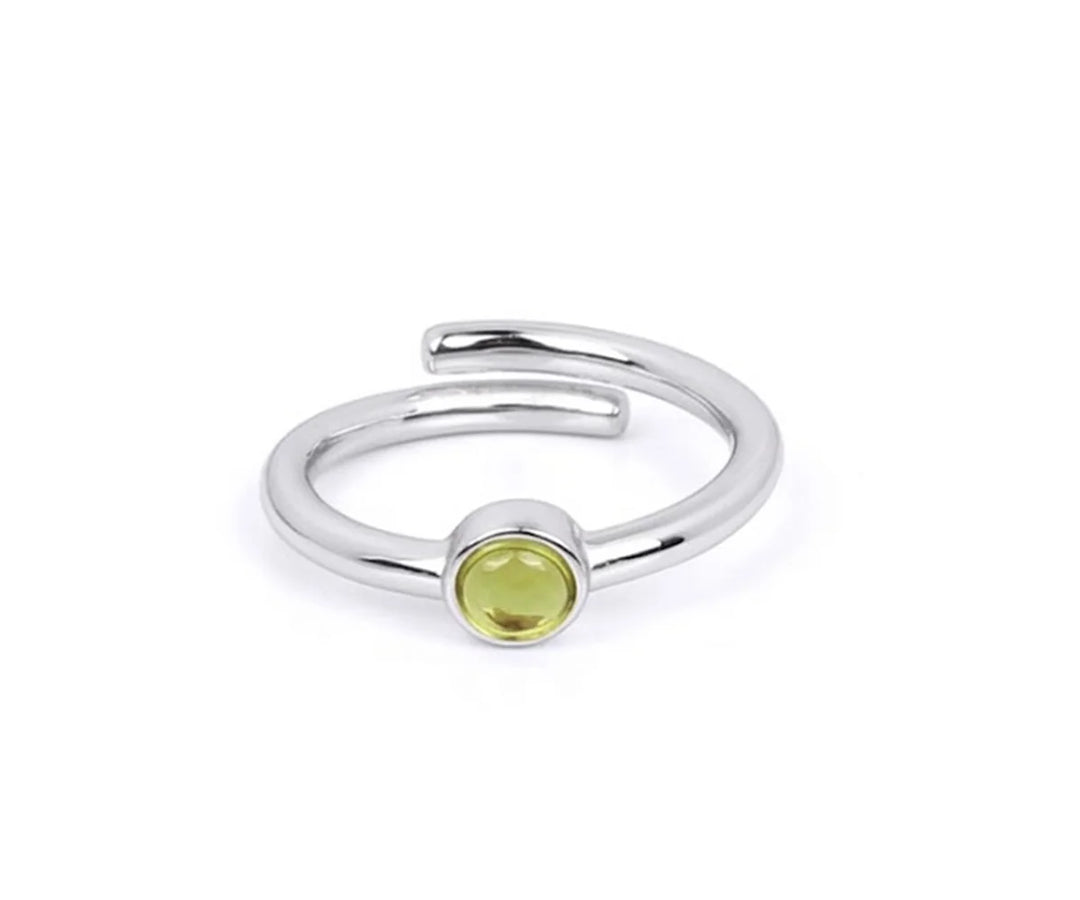 Stylish peridot birthstone ring in silver with a bright lime green gemstone