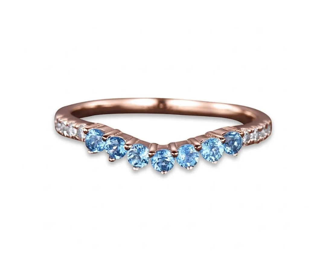 Dainty blue topaz engagement and wedding ring with a delicate setting