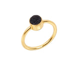 Statement druzy ring with raw crystal finish set in a modern and elegant band
