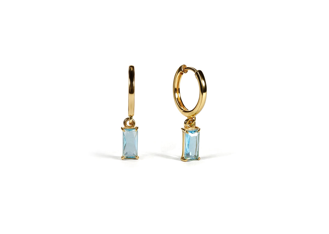 Elegant huggie earrings for women with baguette-cut blue topaz

