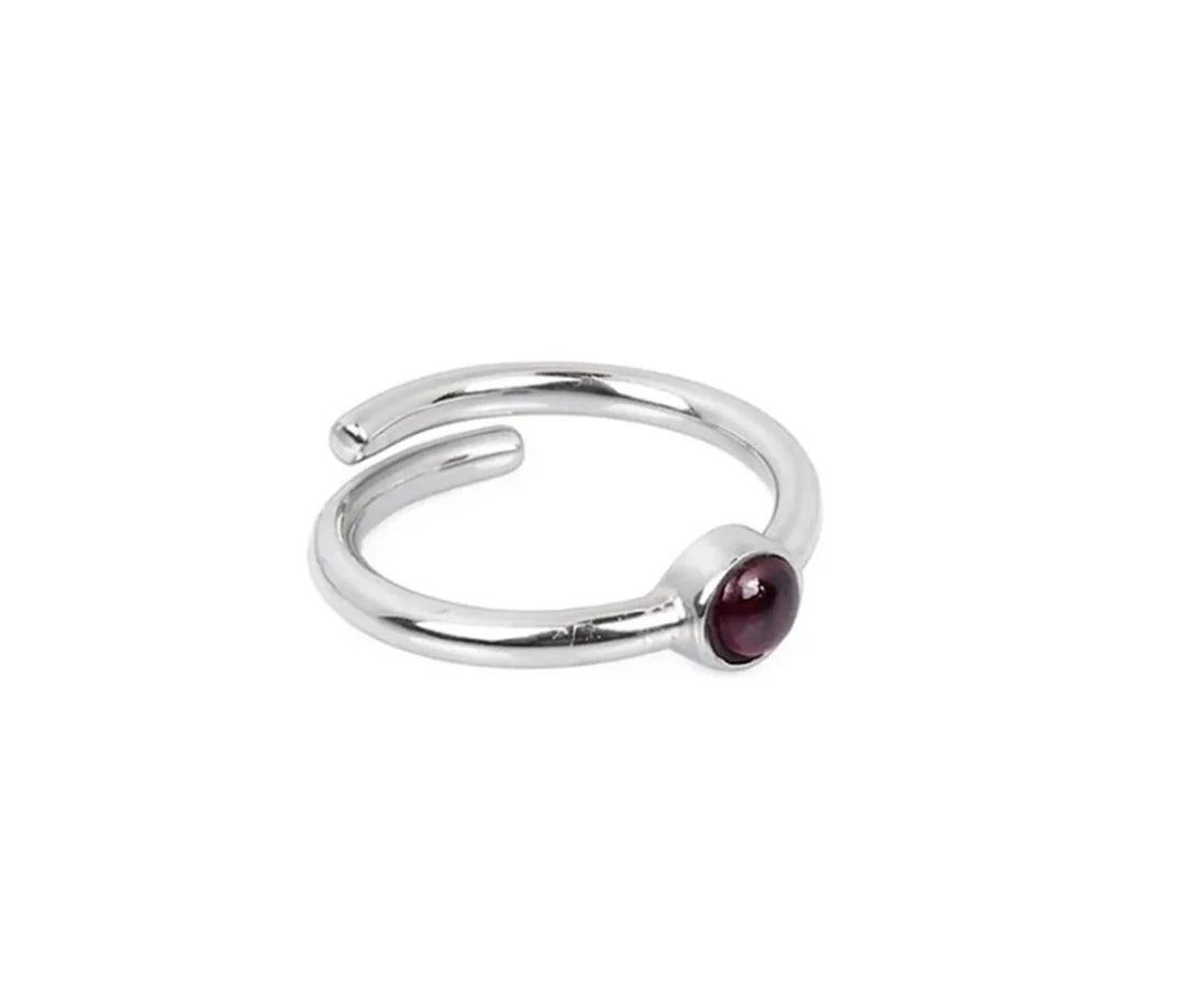 Stunning rhodolite garnet ring with rich raspberry-hued gemstone set in a sleek band ideal for gifting or elegant daily wear