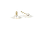 Tiny pearl stud earrings featuring small, lustrous pearls set on delicate posts, adding a subtle and elegant touch to any outfit.
