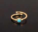 Elegant turquoise gemstone ring with vibrant blue stone set in polished silver band

