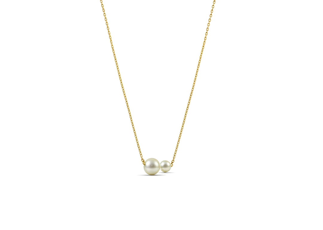 A two pearl necklace featuring two lustrous pearls on a delicate chain, creating a timeless and elegant jewelry piece.