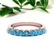 Elegant blue topaz ring featuring a sparkling ocean-blue stone set in minimalist gold-plated sterling silver
