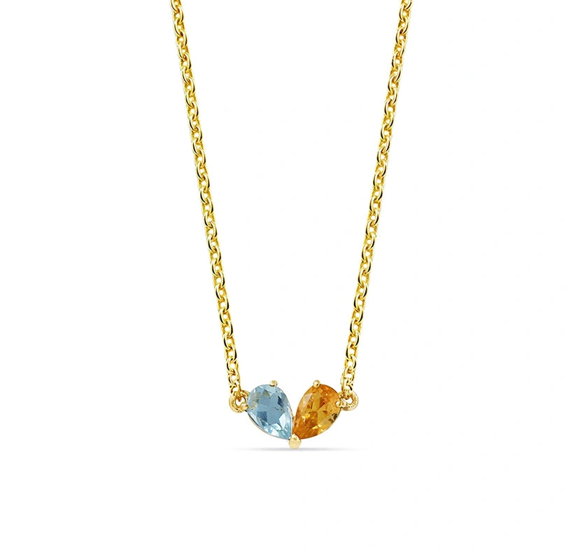 Anniversary topaz and citrine necklace featuring complementary blue topaz and golden citrine gemstones set in an elegant design to celebrate a special milestone.