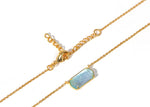 Ocean-inspired necklace displayed on neutral background
