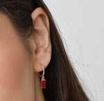 Elegant pink gemstone hoop earrings in gold setting, perfect for everyday wear or gifting.

